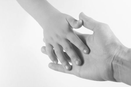 Mother and Child - adult and child with hands together.  Black and white image on white background.の写真素材