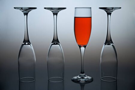 Wineglasses with colored liquid illustrating the concept of possitive thinking.の写真素材