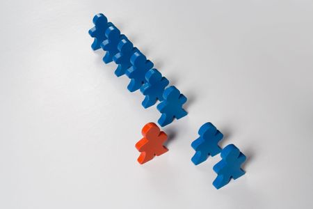 Multicolored wooden people illustrating a business concept - leadership of forward thinking.の写真素材