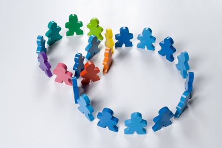 Multicolored wooden people illustrating a business concept - networking or teamwork.の写真素材
