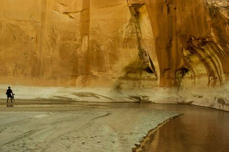 A young photographer in the Paria River Canyon in Utah.の写真素材