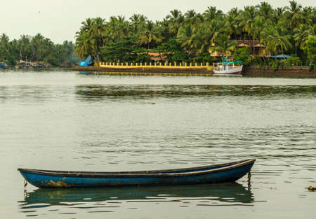 Blue Wooden Fishing Boat at backwatersの写真素材