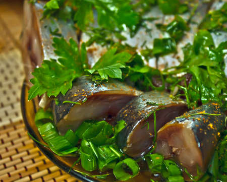 Closeup  marinaded herring strewed