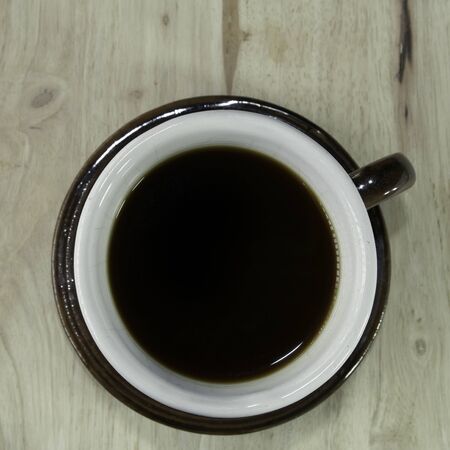 coffee cup top view on the wood, nature and flash lightingの写真素材