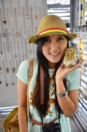 Portrait Thai woman with Owl Dollの写真素材