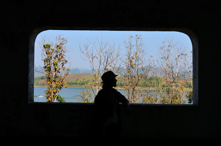 silhouette women with river in Sangkhlaburi District,Kanchanaburi,Thailandの写真素材