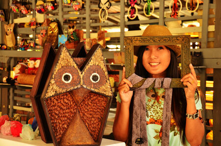 Portrait Thai woman with Owl Doll