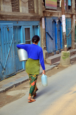 Woman Nepalese people walking at morning time in Patan Durbar Square is situated at the centre of Lalitpur Sub-Metropolitan City in Nepal のeditorial素材
