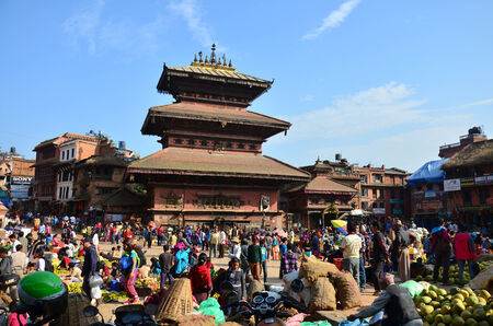 Traveler and Nepalese people come to Bhaktapur Durbar Square for tour and shopping at market on November 2, 2013 in Bhaktapur Nepal のeditorial素材