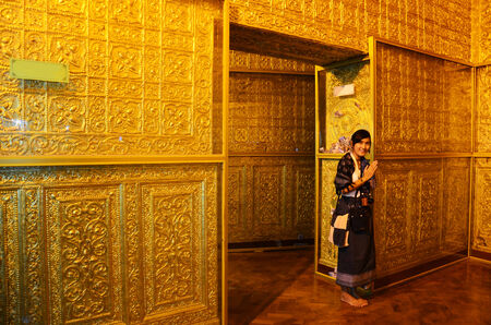 Thai women praying portrait at Inside of Botahtaung Pagoda in yangon Myanmarのeditorial素材