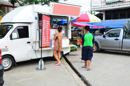 People buy coffee at coffee truck shop on September 14, 2014 in Nonthaburi Thailand.のeditorial素材