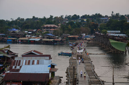 Village at Antique bamboo bridge connecting the main part for use instead Saphan Mon Broken bridge of Songkhla Buri Kanchanaburi Thailand.のeditorial素材