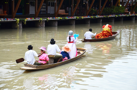 The Lion dance parade on boat is performed by a pair of dancers. They represent protection. Statues of lions are used to guard palaces and other buildings.のeditorial素材