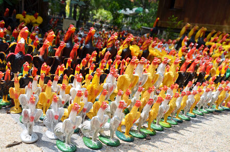 Culture and tradition of thailand.  Praying and Sacrificial offering by use Fighting cock figureのeditorial素材