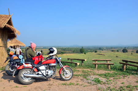 Traveler stop Sport Motorcycle and Chopper Motorcycle for rest at Viewpoint in winter season at Ban Kha is a district in the western part of Ratchaburi Province, central Thailand.の写真素材