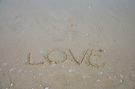 Write word Love on the beach in Phetchaburi Thailandの写真素材