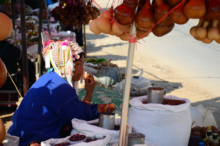 Akha tribe selling product an indigenous at hill of Doi Mae Salong (Mountain) on February 22, 2015 in Chiang Rai, Thailand.のeditorial素材