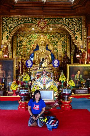 Thai woman portrait at inside church at Wat Ming Mueang on February 23, 2015 in Chiangrai, Thailand.のeditorial素材