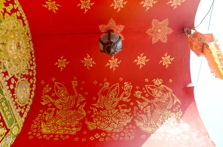 Art painting on ceiling of gate in Wat Ming Mueang at Chiang Rai, Thailandのeditorial素材