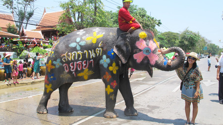 Songkran Festival is celebrated in a traditional New Year is Day from April 13 to 15, with the splashing water with elephants on April 14, 2015 in Ayutthaya, Thailand.のeditorial素材