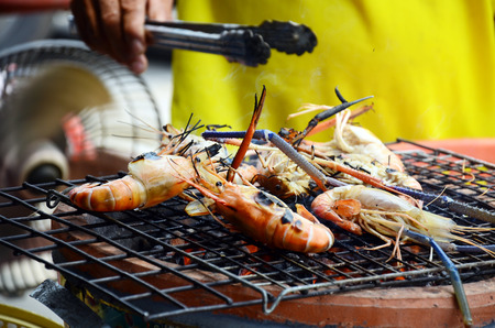 Grilled prawns on Stove Thai Style for sale at Seafood Market in Bangkok Thailand.の写真素材