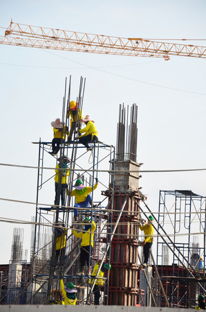 Builder worker in safety protective equipment with Machinery Building Construction Site at Bangkok Thailandのeditorial素材