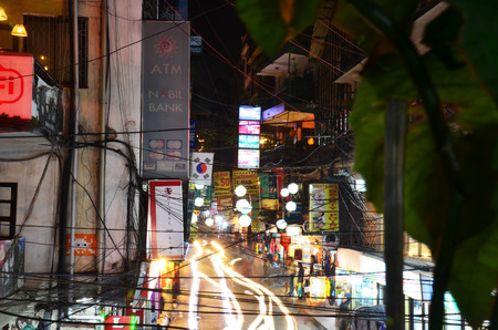 Traveler and Nepalese people on Street Thamel Market for shopping and selling at night time on October 29, 2013 in Kathmandu Nepal.のeditorial素材