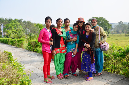 Traveler Thai women take photo with nepalese girl at International Mountain Museum on October 31, 2013 in pokhara of Annapurna Valley Nepalのeditorial素材