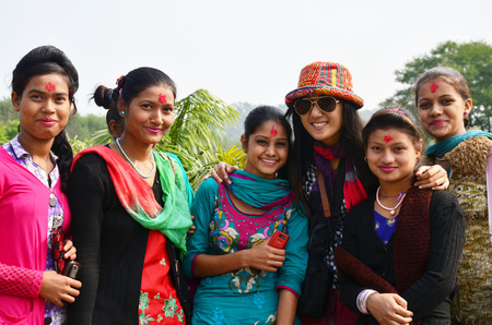 Traveler Thai women take photo with nepalese girl at International Mountain Museum on October 31, 2013 in pokhara of Annapurna Valley Nepalのeditorial素材