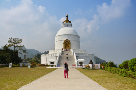 Traveler Thai Women travel go to World Peace Pagoda at Pokhara on October 31, 2013  in Annapurna Valley Nepal  A Peace Pagoda is a Buddhist stupa; a moの写真素材