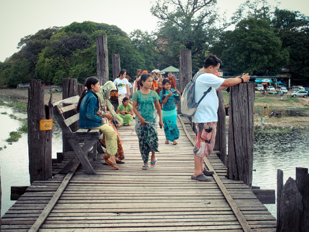 Thai man travel and walking at U Bein Bridge on May 19 2015 in Amarapura Myanmar.のeditorial素材