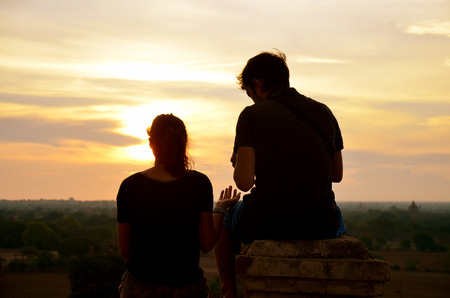 Lovers waiting look sunrise on top of pagoda at Bagan Archaeological Zoneの写真素材