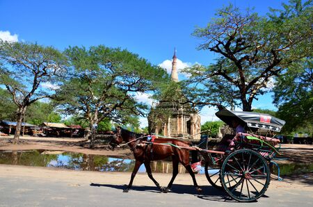 Traveler use horse drawn carriage for travel around ancient city baganのeditorial素材