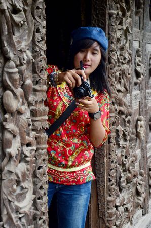 Thai women shooting photo at Shwenandaw Monasteryの写真素材