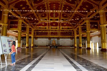 Thai women travel inside of Atumashi Kyaung Monastery in Mandalay, Myanmar.のeditorial素材