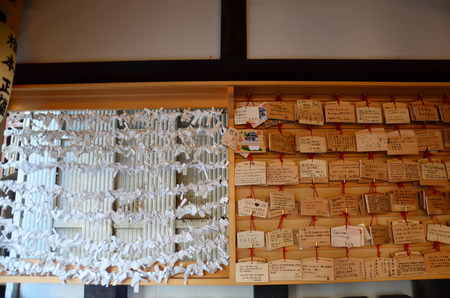 O-mikuji are random fortunes written on strips of paper at Shinto shrines and Buddhist temples in Osaka, Japanのeditorial素材