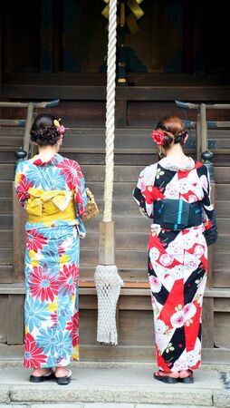 Japanese people wear traditional Japanese clothing (Kimono and Yukatas) praying at Yasaka shrine or Gion Shrine on July 11, 2015 in Kyoto, Japanのeditorial素材
