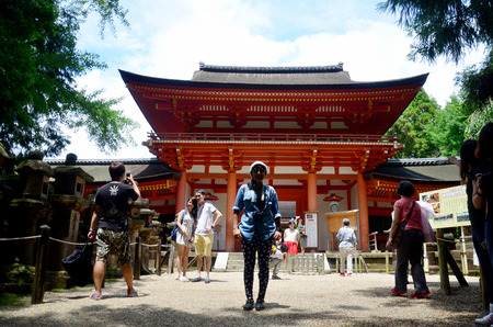 Thai woman and traveller walking at Kasuga Shrine on July 9, 2015 in Nara, Japanのeditorial素材