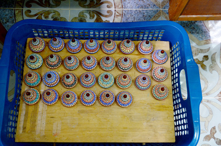 Traditional thai five basic colors style pottery wait bring to process fire oven Ceramic Benjarong at Ban Don Kai Dee on August 8, 2015 in Samut Sakhon Thailand.のeditorial素材