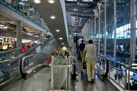 Thai people and foreiner traveller wait and walk at Suvarnabhumi Airport Station on October 8, 2015 in Bangkok, Thailand.のeditorial素材