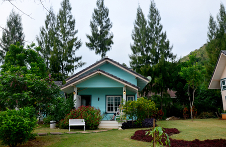 Old people sitting on chair at front of home on November 29, 2015 in Nakhon Ratchasima, Thailand.のeditorial素材