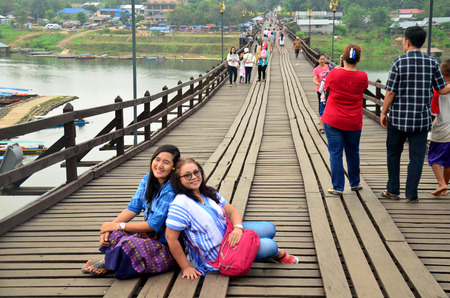 People travel and portrait on Saphan Mon wooden bridge in morning time at Sangkhlaburi on December 4, 2015 in Kanchanaburi, Thailand.のeditorial素材