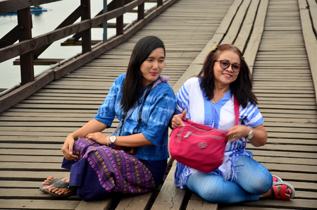 People travel and portrait on Saphan Mon wooden bridge in morning time at Sangkhlaburi on December 4, 2015 in Kanchanaburi, Thailand.のeditorial素材