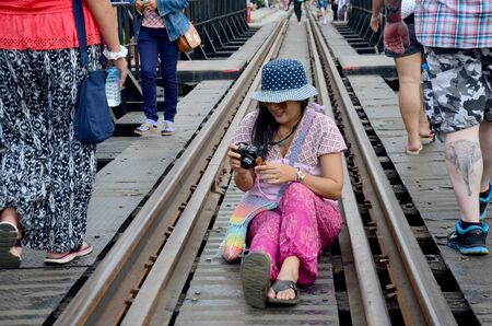Thai women travel and portrait at the Bridge over the River Kwai on December 3, 2015 in Kanchanaburi, Thailand.のeditorial素材