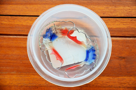 Retainer fashion in white plastic box