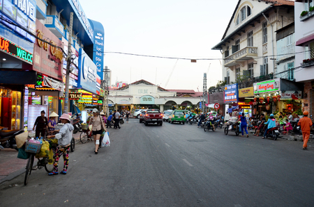 Vietnamese people with Bicycle Fruit and food Shop on street near Ben Thanh Market on January 24, 2016 in Ho Chi Minh, Vietnamのeditorial素材
