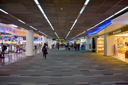 People walk and shopping inside of Don Mueang international airport on January 21, 2016 in Bangkok, Thailandのeditorial素材
