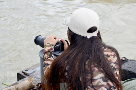 Thai women shooting photo in Long boat Racing at Chaopraya river in Nonthaburi, Thailandのeditorial素材