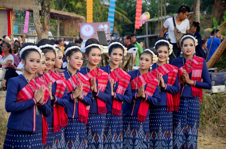 Phu tai people wear clothes national costume phu thai for show and join phu thai world day festival at Ban Non Hom on January 16, 2016 in Sakon Nakhon, Thailandのeditorial素材