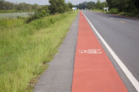 Bicycle lane on the road at countryside in Phatthalung province of southern Thailand.の写真素材